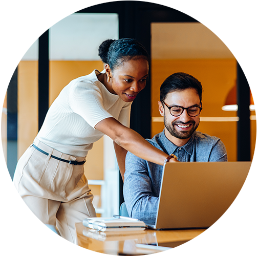 Person sitting in an office at a desk on a teams meeting with four other people